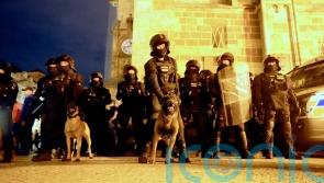 West Ham fans clash with riot police during European final celebrations