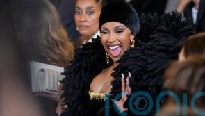 Cardi B and Tracee Ellis Ross sit front row at Schiaparelli show in Paris