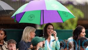 Showers halt play at Wimbledon on Tuesday but better weather to come