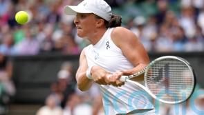 Iga Swiatek breezes through while Ukraine’s Marta Kostyuk fights back to win