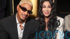 See Cher and Kim Cattrall in power outfits for Balmain fashion show