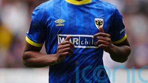 Josh Neufville’s sublime strike helps keep promotion-chasing Wimbledon on track