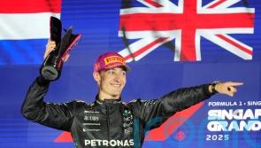 McLaren duo collide on opening lap before George Russell wins Singapore GP