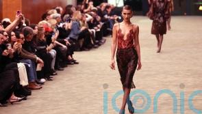 Bella Hadid walks Saint Laurent&rsquo;s tuxedo revival at Paris Fashion Week