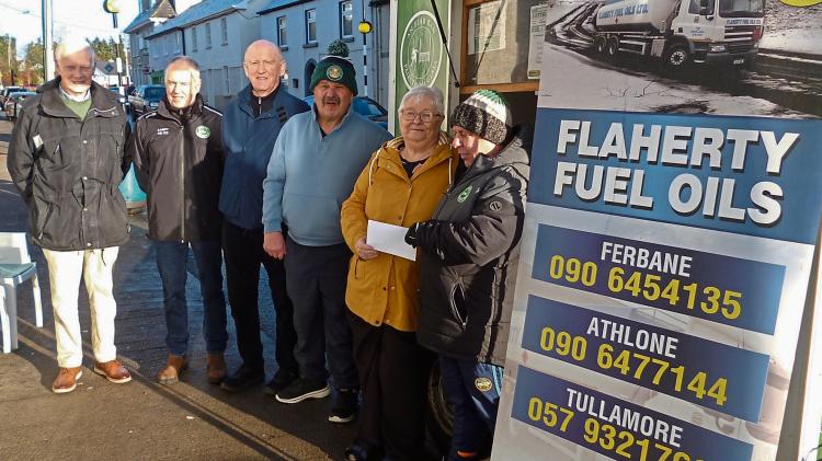 Winner of big jackpot in Offaly club's Lotto draw picks up her cheque