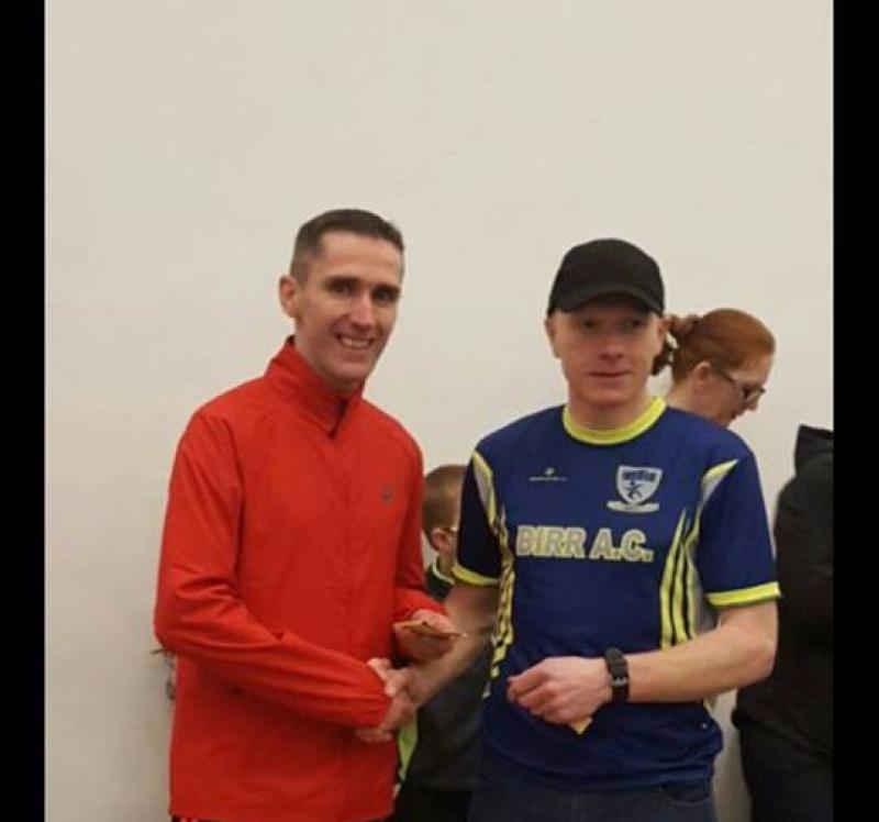 Dave Murray being presented with his prize by Andy Masterson of Birr AC after winning the Sean Lowry Memorial 5k
