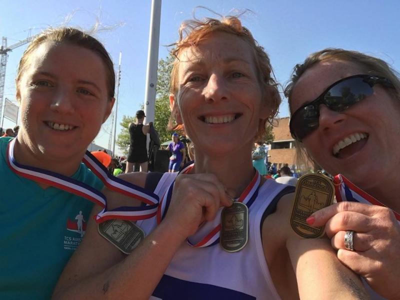 Mary McIntyre, Rita Daly and Hilary O'Shea with their Amsterdam Marathon finishers medals