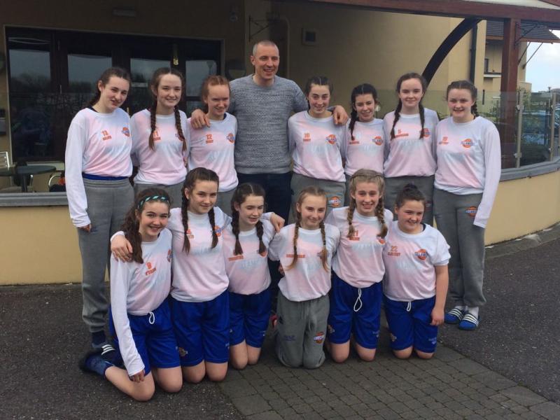 The team pictured with Irish basketball star and Kerry football legend Kieran Donaghy