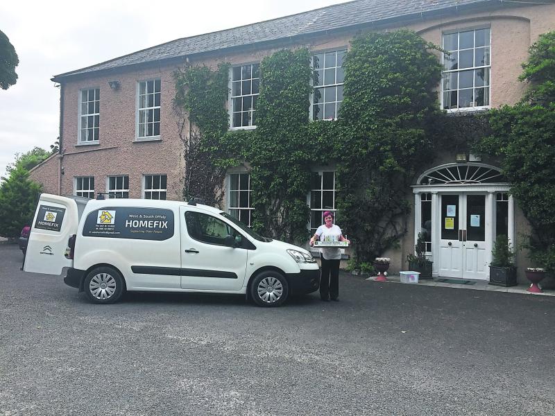 Pictured is a staff member of Elmgrove Nursing Home, Birr taking delivery of one of the GIY salad boxes recently