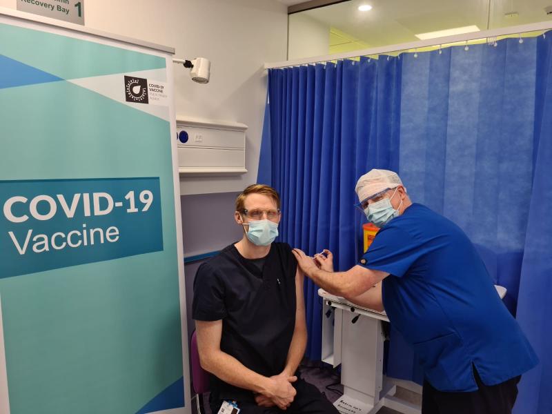 Stephen DeRighetti, Enhanced General Nurse getting the vaccine from his colleague Neil Perry, Clinical Skills Facilitator Emergency Department