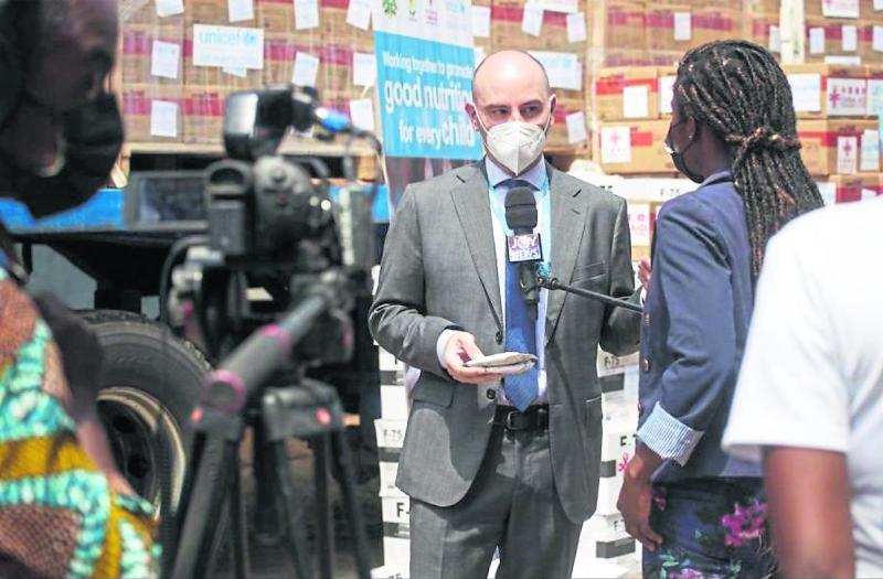Fiachra McAsey speaks to Ghanaian TV at the handover of Covid-19 vaccines to authorities in Ghana at the end of February &copy;UNICEF (Picture, Unicef) 