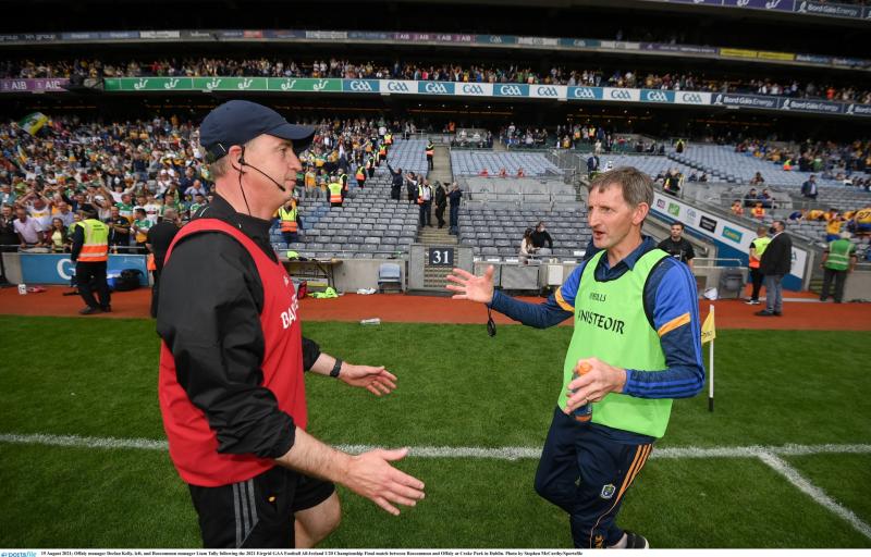 Roscommon manager Liam Tully congratulates Declan Kelly after Offaly's win.