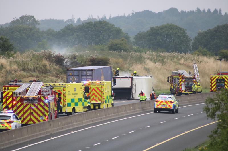 Lorry overturns and catches fire on motorway after crash 