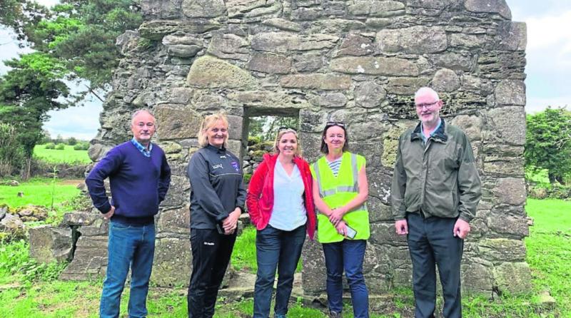 L. to r. Seamus Corcoran, Dora Corcoran, Cathy Moore, archaeologist, Dr Ellen O'Carroll, archaeologist, and Se&aacute;n Corcoran at St Mella's Cell, Lemanaghan on Saturday morning.
