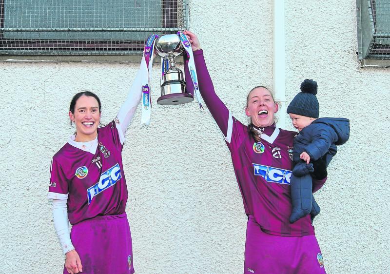 Joint captains Tina Bradley and Louise Dougan raise the Ulster trophy for Slaughtneil_