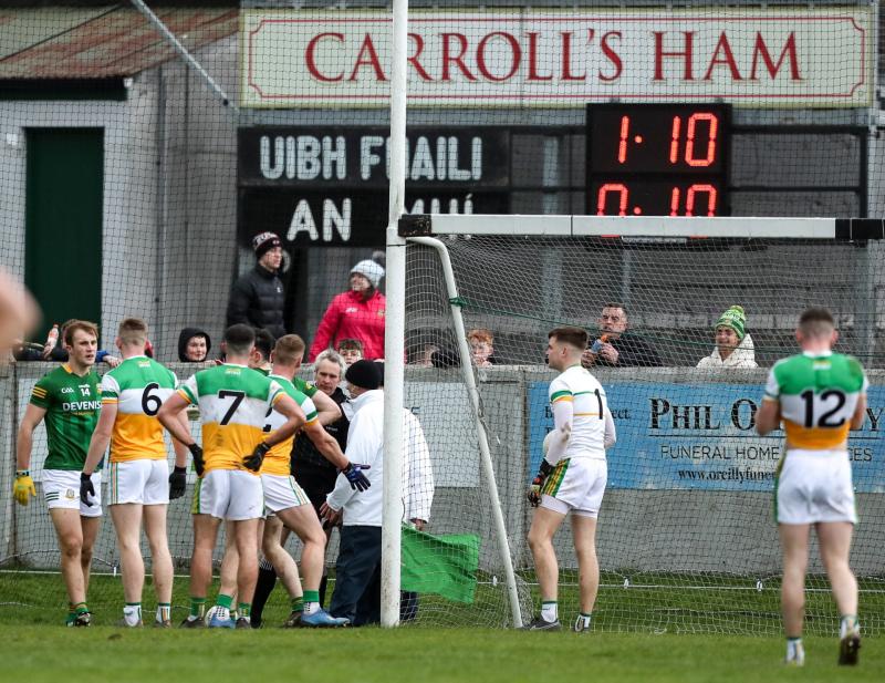 Referee Fergal Kelly consults his umpires on the decision of Meath's goal