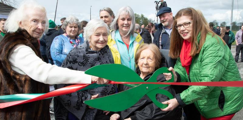 Bernadette, Maureen, Mary, Pat and Fiona McDermott cutting the ribbon at Pairc McDiarmada, Durrow