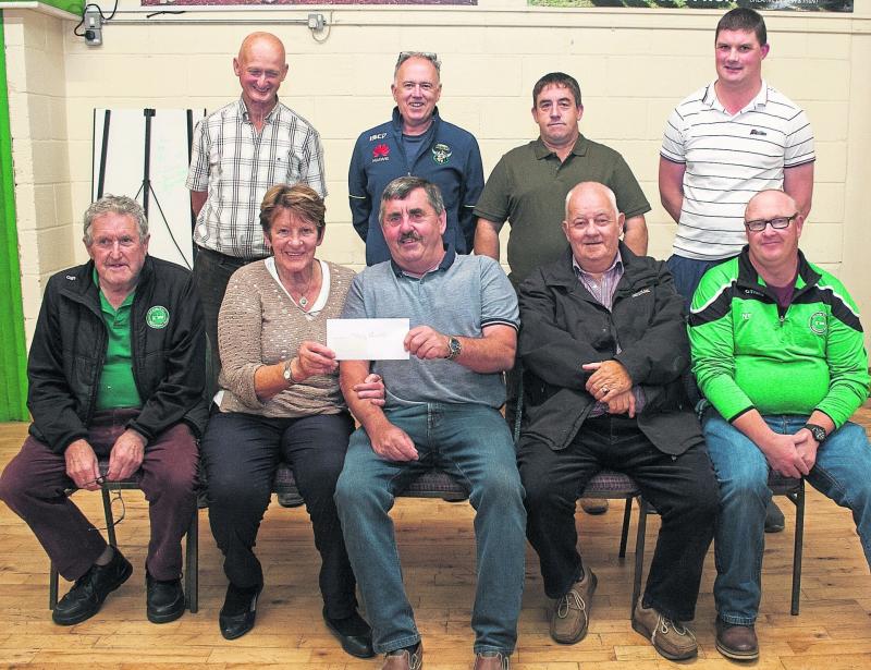 Lucky jackpot winner in Offaly GAA Club Lotto picks up cheque