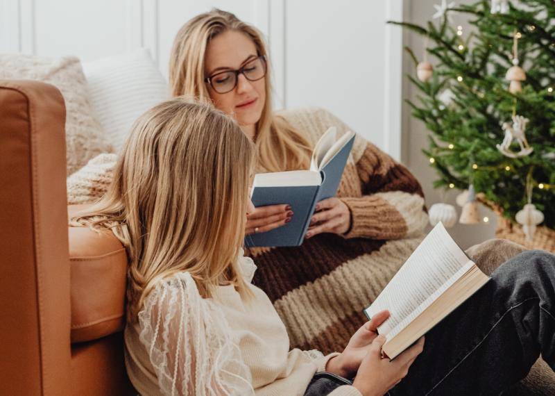 Mother and teenager reading