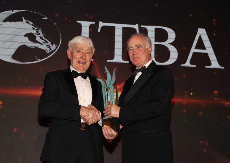 Tom Lacey being presnted with his prestifious award by John O'Connor