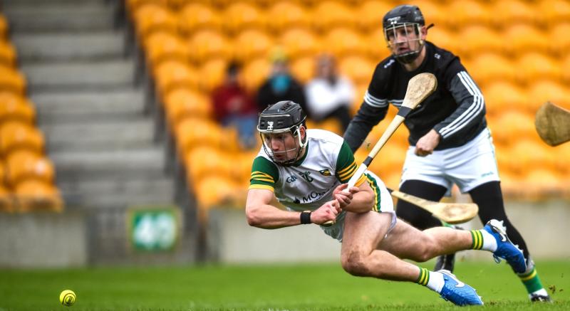 Dan Ravenhill scores a goal for Ballinamere ahead of Conor Slevin in last year's final.