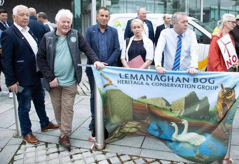 Councillors Declan Harvey, Oliver Bryant. Claire Murray-Smale  and Frank Moran speaking to protestors prior to monthly meeting of council  
