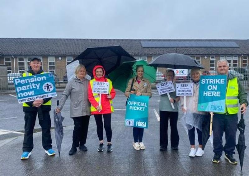 Caretakers Joe Geoghegan, Paddy Scanlon and Secretary  Olive Brennan being supported outside Scoil Bhr&iacute;de Clara 