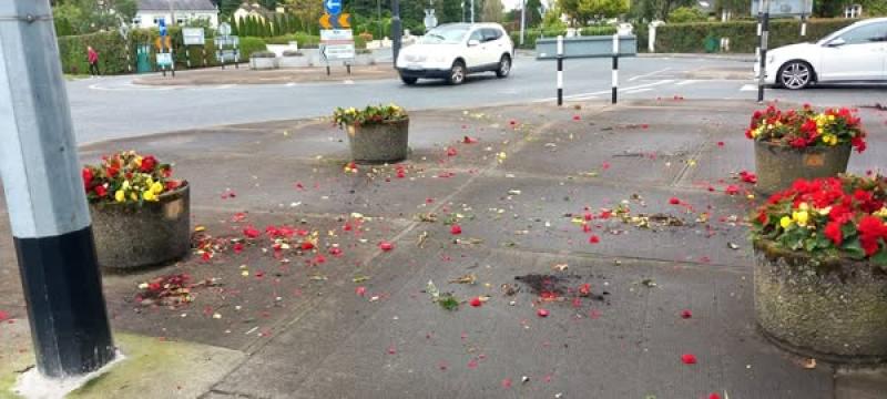 The flower planters are located near the roundabout at Church Road