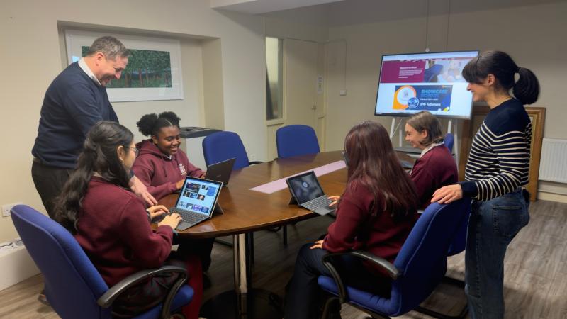 School deputy principal Sean McFadden (left) with students and digital coordinator Gloria Enrique
