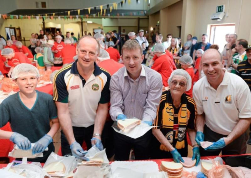 9 June 2013; Taking part in the Carrolls ham sandwich world record attempt  in aid of Irish Autism Action are, from left, Brian Duignan, age 12, from Durrow, Co. Offaly, Offaly's Joe Dooely, Offaly's Brian Whelehan, Ann Purcell, from Mooncoin, Co. Kilkenny, and Kilkenny's DJ Carey. A new record of 3,140 sandwiches in 37 minutes was set. Leinster GAA Hurling Senior Championship Quarter-Final, Offaly v Kilkenny, O'Connor Park, Tullamore, Co. Offaly. Picture credit: Brian Lawless / SPORTSFILE