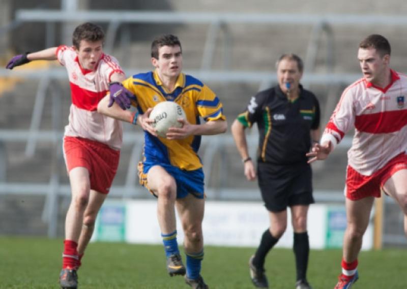 Scoil Aodhain's Cathal Doran and Alan O'Brien closing in to challenge Colaiste Iosagain's Jack Walsh Picture: Ger Rogers/HR Photo.