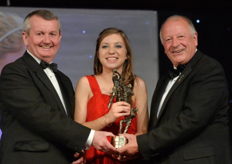 9 November 2013; M�iread Daly, Offaly, is presented with the TG4 Junior Players' Player of the Year Award by Pat Quill, President of the Ladies Gaelic Football Association, in the company of P�l O Gallch�ir, Ceannsa�, TG4. TG4 Ladies Football All-Star Awards 2013, Citywest Hotel, Saggart, Co. Dublin. Picture credit: Brendan Moran / SPORTSFILE *** NO REPRODUCTION FEE ***