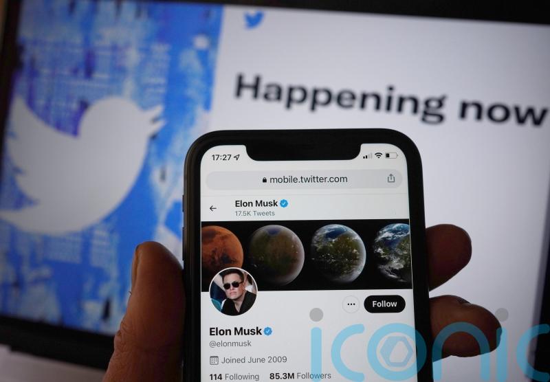 Elon Musk says Twitter deal ‘temporarily on hold’ but is 'still committed' to buying the platform