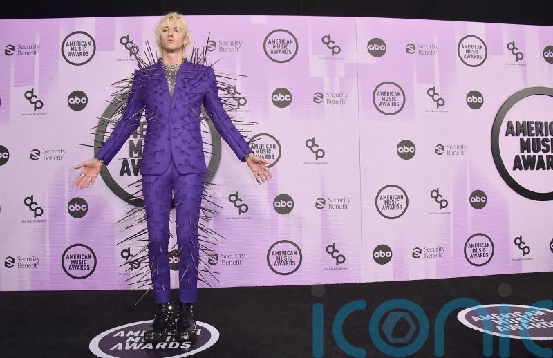 Machine Gun Kelly dons extravagant spiked suit at the AMAs