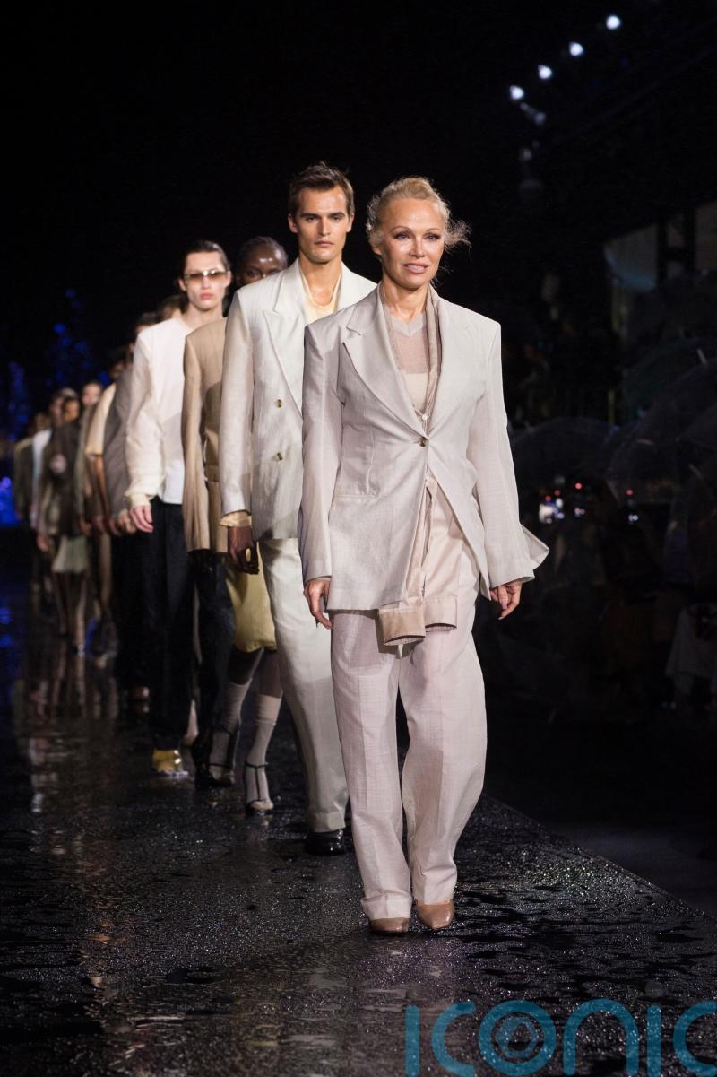 Pamela Anderson and Naomi Campbell walk the Miami runway for Hugo Boss