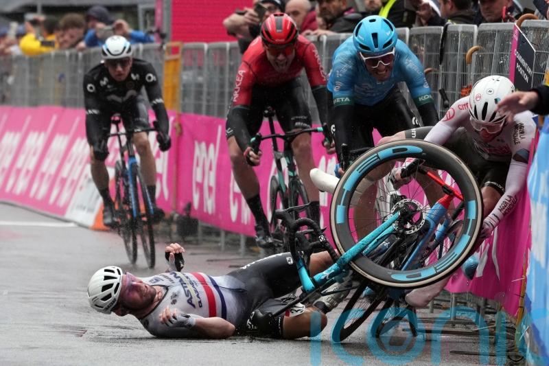 Kaden Groves wins stage five of Giro d’Italia as stray dog and rain cause chaos