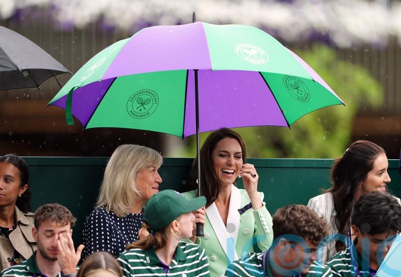 Showers halt play at Wimbledon on Tuesday but better weather to come