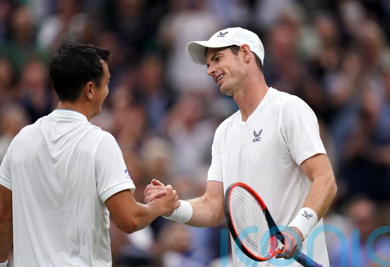 Wimbledon day two: Andy Murray puts on a show as rain decimates schedule