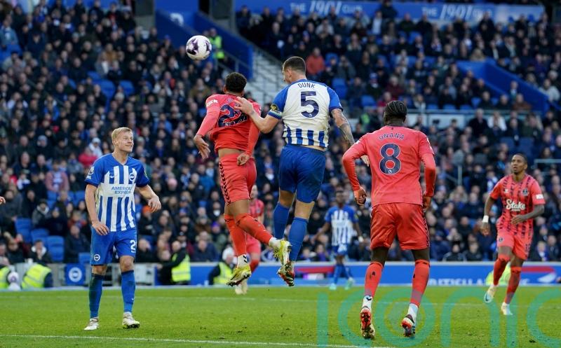 Lewis Dunk’s last-gasp leveller earns 10-man Brighton draw with Everton