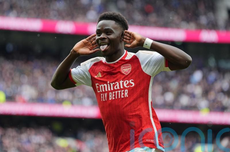 Arsenal withstand Tottenham’s second-half fightback to boost title hopes