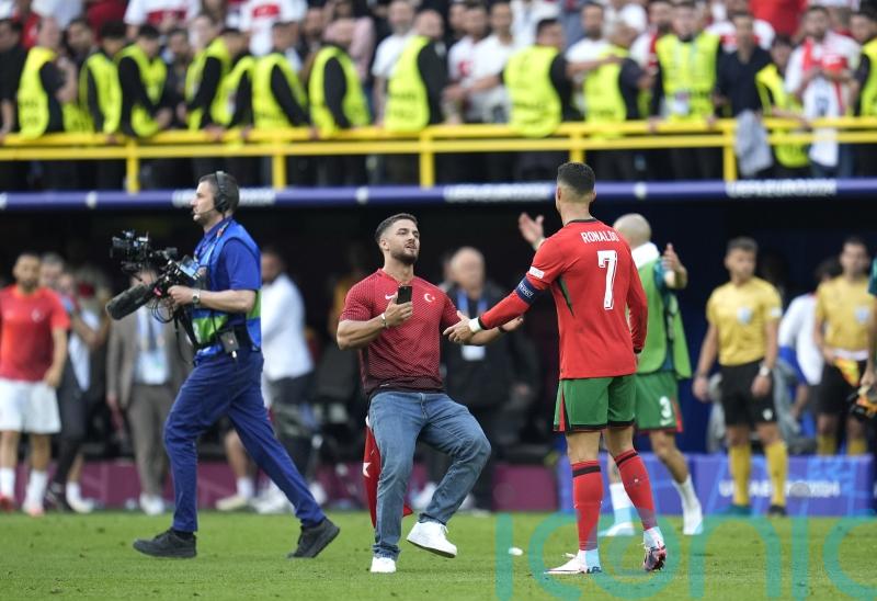 Portugal boss Roberto Martinez voices worry over pitch invaders seeking selfies