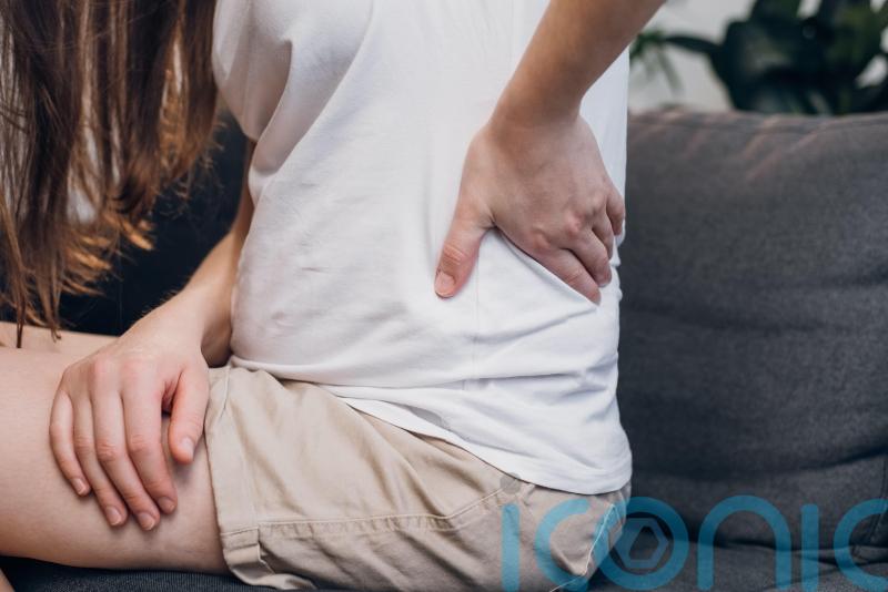 What happens to bone density in menopause?