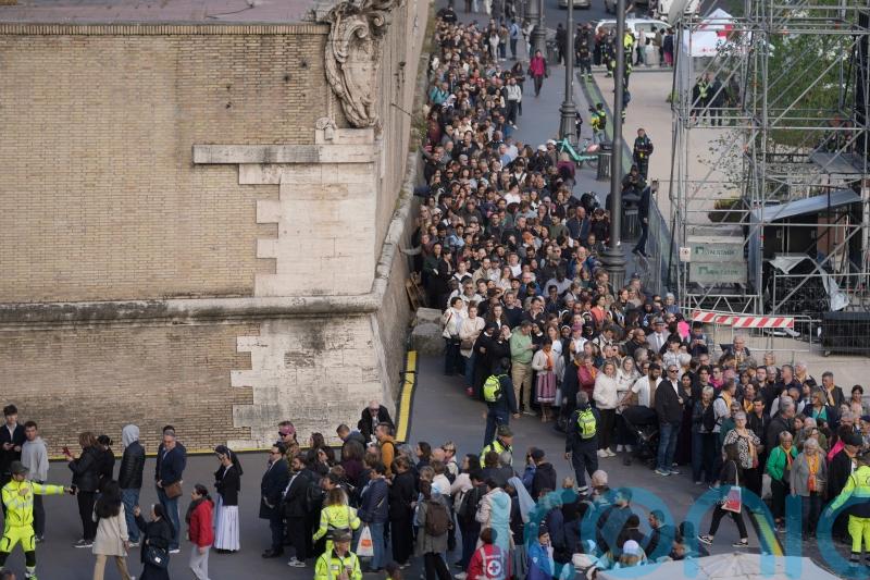 Mourners queue overnight to see popular Pope as Vatican extends opening hours