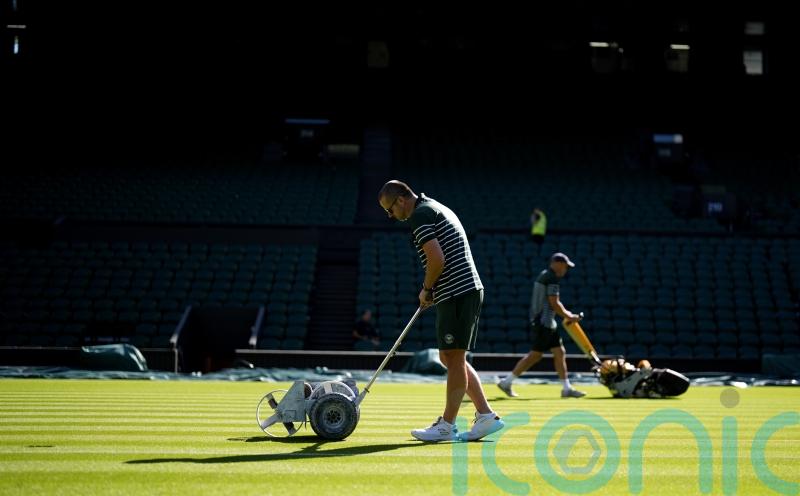Wimbledon groundsman says Centre Court holding firm amid record heat