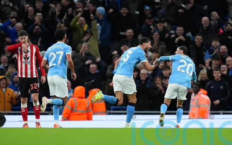 Man City close gap on leaders Arsenal with one-sided win over Sunderland