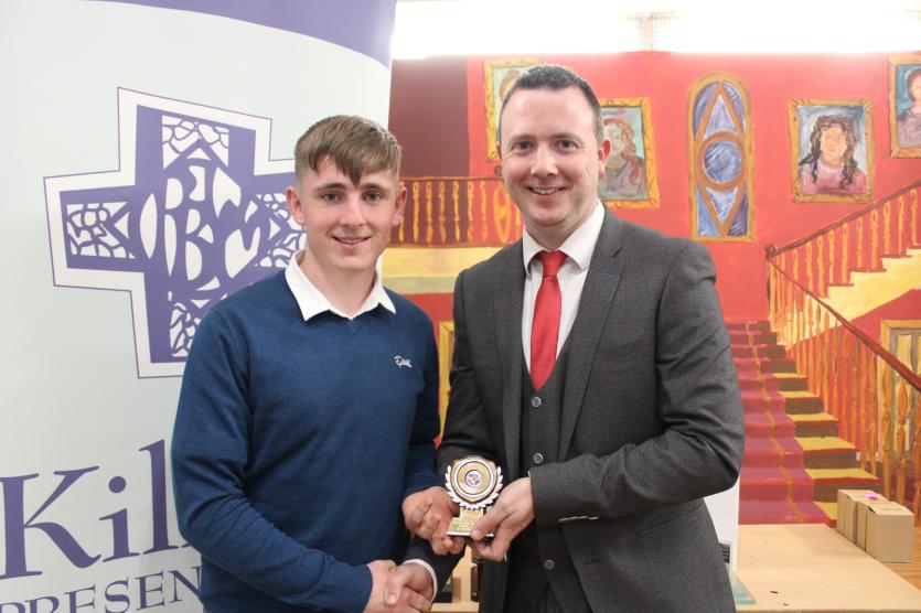 Killina Senior Hurler of the Year Ger Buckley receiving his award from Deputy Principal Mr. Aidan Lawless.