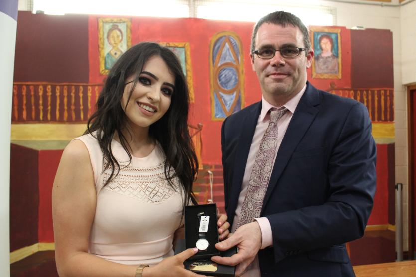 Outstanding Contribution to School Life Award Winner Sarah White receiving her award from Principal Mr. John Cotter.