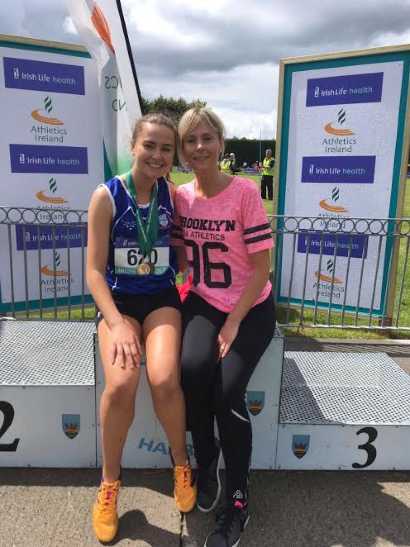 Ava O'Connor with her All Ireland medal won in the Minor Girls 800m at the weekend. She's pictured here with her mother Sinead.