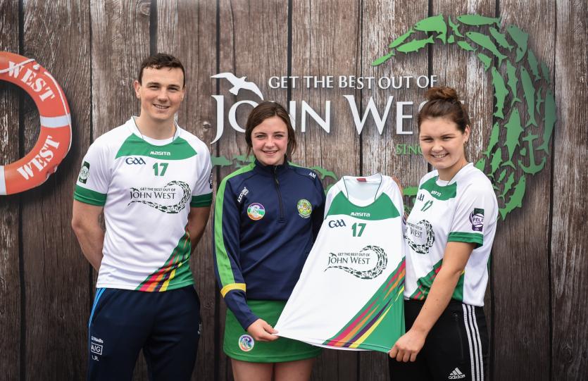 Ava Moloney from Shinrone GAA Club, Co Offaly, pictured with Dublin&rsquo;s Liam Rushe and Carlow's Kate Nolan after participating in the camogie competitio