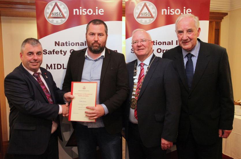 John Jones from Ferbane receives his award from Minister Moran